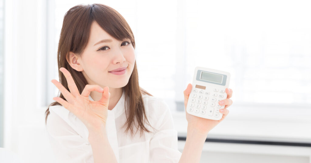 woman holding a calculator